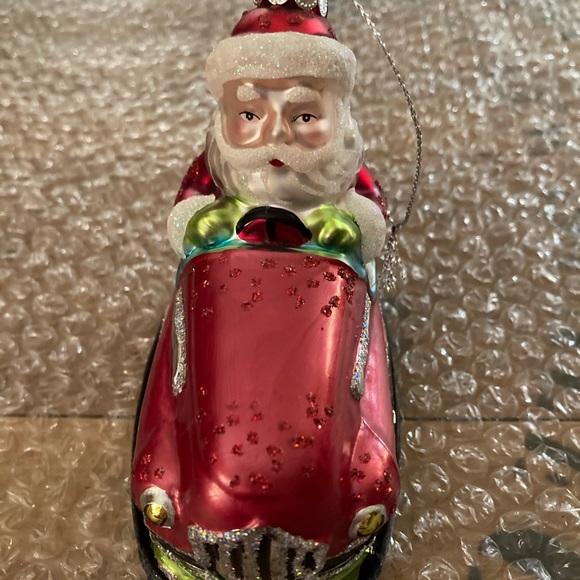 Santa riding a bumper car glass Christmas Ornament - Picture 2 of 8